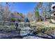 Scenic view of a pond with gazebo and surrounding natural landscape at 150 Stone Pond Ln, Johns Creek, GA 30022