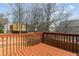 View from the wood deck showing a wood railing and a view of bare trees at 4263 Winslow Hill Ct, Suwanee, GA 30024
