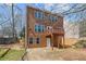 Backyard view shows exterior of home, deck, and landscaping at 4263 Winslow Hill Ct, Suwanee, GA 30024