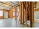 Unfinished basement view with concrete floor, wooden beams, and staircase at 4263 Winslow Hill Ct, Suwanee, GA 30024