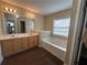 Bright bathroom featuring a double vanity and soaking tub for ultimate relaxation at 4263 Winslow Hill Ct, Suwanee, GA 30024