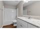 Bathroom with white cabinets, granite counters, tub, and white tile at 4263 Winslow Hill Ct, Suwanee, GA 30024