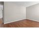 Empty bedroom with fresh paint, wood-look flooring, and a doorway at 4263 Winslow Hill Ct, Suwanee, GA 30024