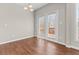 Bright dining area with a chandelier and sliding glass doors leading to an outdoor deck space at 4263 Winslow Hill Ct, Suwanee, GA 30024