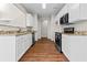 Modern kitchen with granite counters, stainless steel appliances, and white cabinets at 4263 Winslow Hill Ct, Suwanee, GA 30024