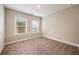 Bright bedroom with two windows offering ample natural light and plush carpet at 2285 Moondance Ln, Marietta, GA 30062