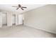 Spacious bedroom featuring large windows, neutral carpet and paint, and an ensuite bathroom at 3775 Norman Rd, Clarkston, GA 30021