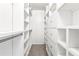 Walk-in closet with built-in shelving and drawers for ample storage and organization at 3775 Norman Rd, Clarkston, GA 30021