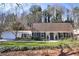 Inviting single-Gathering home with a manicured lawn, attached garage, and classic exterior design at 4234 Long Branch Ne Ct, Brookhaven, GA 30319
