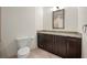 Traditional bathroom with granite countertop over cabinets and tile flooring at 1080 Peachtree Ne St # 2207, Atlanta, GA 30309