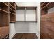 This walk-in closet features custom shelving and drawer units, providing ample storage space at 1080 Peachtree Ne St # 2207, Atlanta, GA 30309