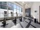 Cardio machines with large windows with city views in the fitness center at 1080 Peachtree Ne St # 2207, Atlanta, GA 30309