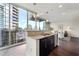 Kitchen features stainless steel appliances, modern counter tops, and city views from the kitchen sink at 1080 Peachtree Ne St # 2207, Atlanta, GA 30309