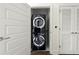 Stacked full size washer and dryer with folding doors at 1080 Peachtree Ne St # 2207, Atlanta, GA 30309