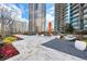 Elegant outdoor lounge area with modern furniture, landscaping, and city backdrop for ultimate relaxation at 1080 Peachtree Ne St # 2207, Atlanta, GA 30309