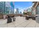 Spacious outdoor patio with comfortable seating and city views, perfect for relaxing or entertaining guests at 1080 Peachtree Ne St # 2207, Atlanta, GA 30309