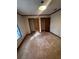 Bedroom with original wood subflooring and a large closet at 3118 Rockbridge Road Southwest, Avondale Estates, GA 30002