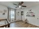 Charming Bedroom with wood floors, ample natural light, and a rocking chair at 3852 Old Bridge Way, Duluth, GA 30096