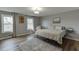 Bedroom with hardwood floors, neutral colors, and two windows at 3852 Old Bridge Way, Duluth, GA 30096