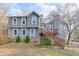 Charming two-story home featuring a stone foundation and inviting wooden staircase at 3852 Old Bridge Way, Duluth, GA 30096