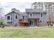 Back exterior view of home with deck and patio at 3852 Old Bridge Way, Duluth, GA 30096