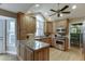 Modern kitchen with light wood cabinets, granite countertops, and stainless steel appliances at 3852 Old Bridge Way, Duluth, GA 30096