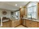 Kitchen with stainless steel appliances, hardwood floors, and a large window over the sink at 3852 Old Bridge Way, Duluth, GA 30096