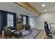 Cozy living room features hardwood floors, wood beam, and blue accent wall at 3852 Old Bridge Way, Duluth, GA 30096