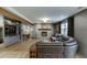 Open living area with stone fireplace, dark brown leather sofa, and built-in shelving at 3852 Old Bridge Way, Duluth, GA 30096