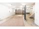 Spacious unfinished basement with exposed pipes and wooden staircase, and plenty of potential at 4103 Statewood Ne Rd, Atlanta, GA 30342