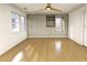 Spacious bedroom with hardwood floors, a ceiling fan, and large window for great natural light at 4103 Statewood Ne Rd, Atlanta, GA 30342