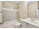 Bathroom with a tub-shower combination, a single sink vanity, and neutral tile at 6445 Glen Oaks Ln, Atlanta, GA 30328