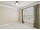 Bright bedroom featuring shuttered windows, neutral walls, and plush carpeting at 6445 Glen Oaks Ln, Atlanta, GA 30328