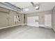 Spacious garage with epoxy flooring, storage cabinets, and ample room for vehicles at 6445 Glen Oaks Ln, Atlanta, GA 30328