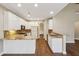 Bright kitchen featuring white cabinets, granite countertops, and stainless steel appliances at 6445 Glen Oaks Ln, Sandy Springs, GA 30328