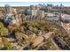 Scenic aerial view of apartments, trees, and Atlanta skyline in the distance at 100 Biscayne Nw Dr # E1, Atlanta, GA 30309