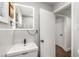 Elegant bathroom featuring marble tile, modern vanity with lighting, and sleek fixtures, providing a luxurious and refreshing experience at 100 Biscayne Nw Dr # E1, Atlanta, GA 30309