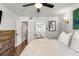 Bright bedroom features a ceiling fan, warm lighting, and entry to a closet and bathroom at 100 Biscayne Nw Dr # E1, Atlanta, GA 30309