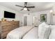 Relaxing bedroom featuring a ceiling fan, dresser, and soothing ambiance, perfect for restful nights at 100 Biscayne Nw Dr # E1, Atlanta, GA 30309