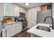 Updated kitchen featuring white cabinets, stainless steel appliances, and marble countertops at 100 Biscayne Nw Dr # E1, Atlanta, GA 30309