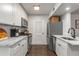 Updated kitchen featuring white cabinets, stainless steel appliances, and marble countertops at 100 Biscayne Nw Dr # E1, Atlanta, GA 30309