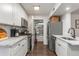 Charming kitchen featuring white cabinets, marble countertops, and stainless steel appliances, offering a modern and functional space at 100 Biscayne Nw Dr # E1, Atlanta, GA 30309