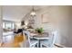 Open-concept dining area with hardwood floors, a stylish light fixture, and great natural light at 2336 Vistamont Dr, Decatur, GA 30033