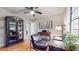 Bright home office featuring hardwood floors, built-in shelving, and a desk illuminated by natural light at 2336 Vistamont Dr, Decatur, GA 30033