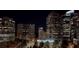 Nighttime view of a city skyline with illuminated skyscrapers and a dark blue sky at 40 12Th Ne St # 1503, Atlanta, GA 30309