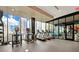 Gym featuring treadmills, bikes, and elliptical machines with city views at 40 12Th Ne St # 1503, Atlanta, GA 30309