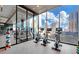 Fitness center with floor-to-ceiling windows offering city views and exercise equipment at 40 12Th Ne St # 1503, Atlanta, GA 30309