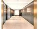 Sleek hallway featuring marble walls and modern elevator access at 40 12Th Ne St # 1503, Atlanta, GA 30309