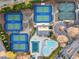 Overhead shot of tennis courts and a pool, highlighting the community's recreational amenities at 6955 Laurel Oak Dr, Suwanee, GA 30024