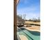 Backyard features a pool, bar area, fire pit, and golf course views at 6955 Laurel Oak Dr, Suwanee, GA 30024